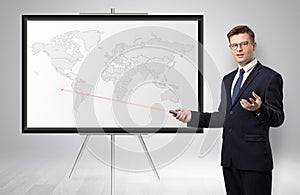Businessman presenting potential business area on map