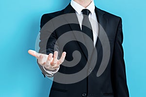 Businessman presenting something in his hand