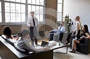 Businessman presenting to colleagues at an informal meeting