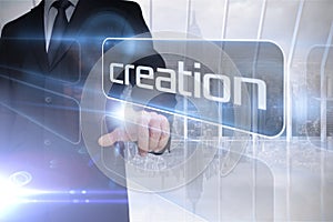 Businessman presenting the word creation