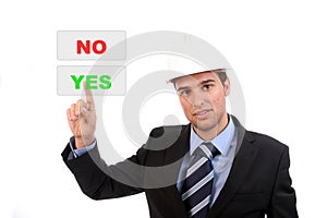 Businessman presses yes button