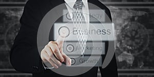 Businessman Pressing Button, Icons on Virtual Screen. Business, Marketing, Strategy