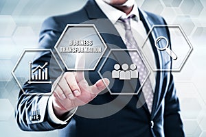 Businessman pressing button on touch screen interface and select business transformation