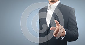 Businessman pressing button virtual screen