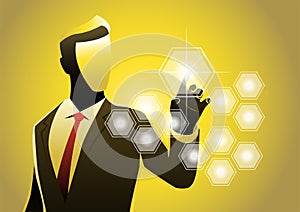 A businessman pressing button on virtual screen