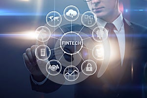 The businessman pressing buttons in fintech concept