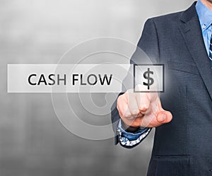 Businessman pressing Cash Flow button on virtual screens