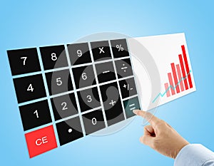 businessman pressing equal sign button on wide screen digital calculator with red bar graph on display