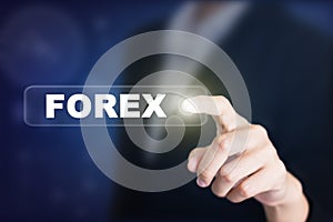 Businessman pressing a FOREX concept button.