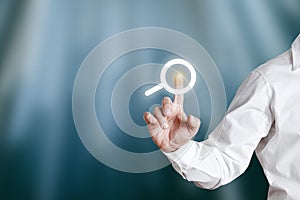 Businessman pressing internet search button on a virtual display screen