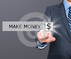 Businessman pressing make money button on virtual screens