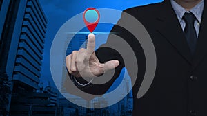 Businessman pressing map pin point location button over modern office city tower and skyscraper, Map pointer navigation online con