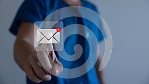 Businessman pressing messaging type of modern icons with virtual background. An email not read.