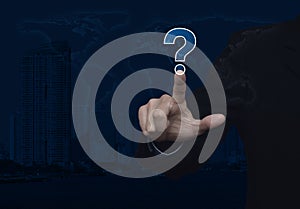 Businessman pressing question mark sign icon over world map and