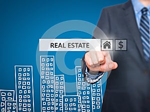 Businessman pressing real estate button on virtual screens