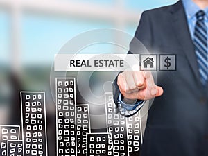 Businessman pressing real estate button on virtual screens