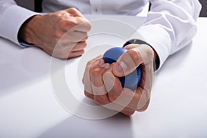 Businessman Pressing Stress Ball