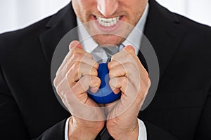 Businessman Pressing Stress Ball