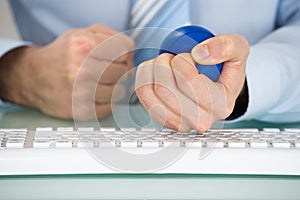 Businessman Pressing Stressball