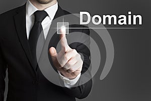 Businessman pressing virtual button domain