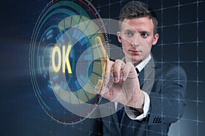 The businessman pressing virtual button ok