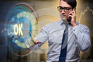 The businessman pressing virtual button ok