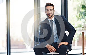 Businessman, pride and chair in office with portrait for ambition, success and career mindset. Corporate person, suit