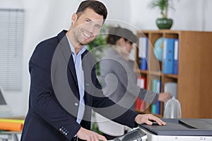 Businessman printing and scaning document