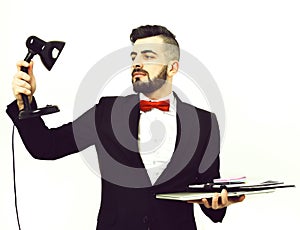 Businessman or project announcer holds black lamp and laptop