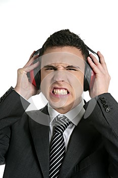 Businessman protecting from noise with headphones