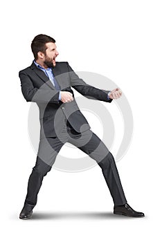 Businessman pulling invisible rope