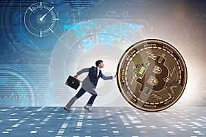 The businessman pushing bitcoin in cryptocurrency blockchain concept