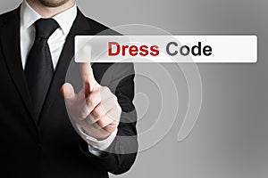 Businessman pushing button dress code