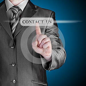 Businessman pushing CONTACT US sign