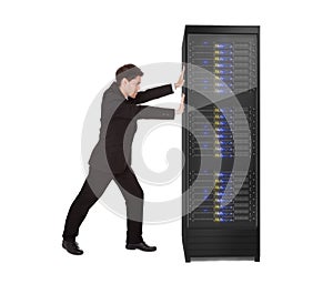 Businessman pushing server rack photo