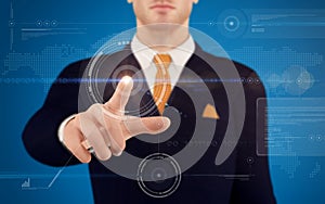 Businessman pushing on a touch screen button