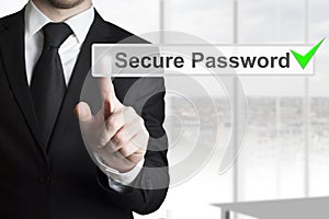 Businessman pushing touchscreen secure password checked green