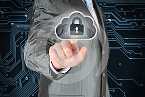 Businessman pushing virtual cloud security button