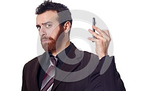 Businessman puts his phone away from his ear