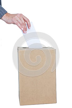 Businessman putting ballot in vote box