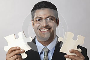 Businessman putting the puzzle together