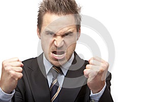 Businessman is quite angry and shows fists