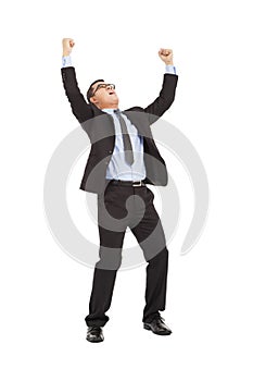 Businessman raise arms up to win the competition