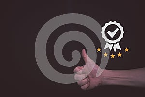 Businessman raised thumps up with Satisfaction Guarantee and five stars rating, sign of the top service Quality assurance