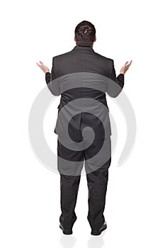 Businessman raising arms in disbelief photo