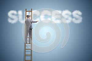 The businessman reaching success with career ladder