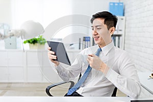 Businessman read news with tablet
