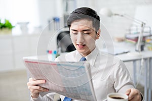 Businessman read newspaper