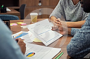 Businessman reading annual report