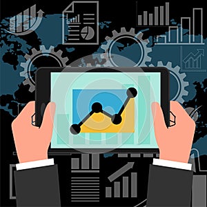 Businessman reading business graphs and stock charts on tablet